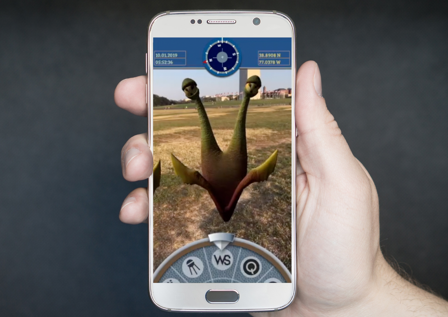 A hand holding a phone, showing a creature found in the game.