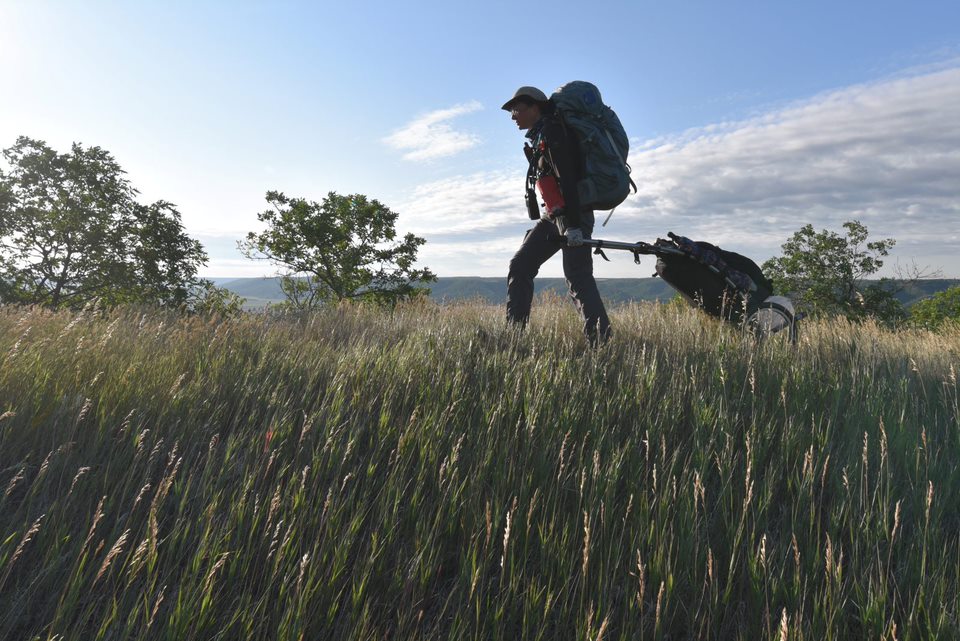 Sonya Richmond hiking in a meadow.