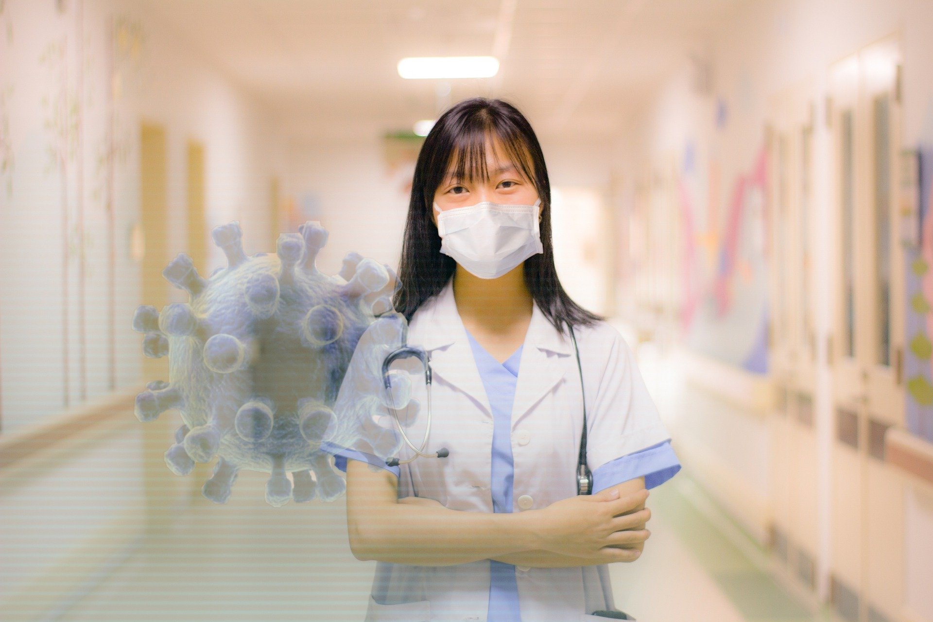 Doctor or nurse with COVID virus superimposed