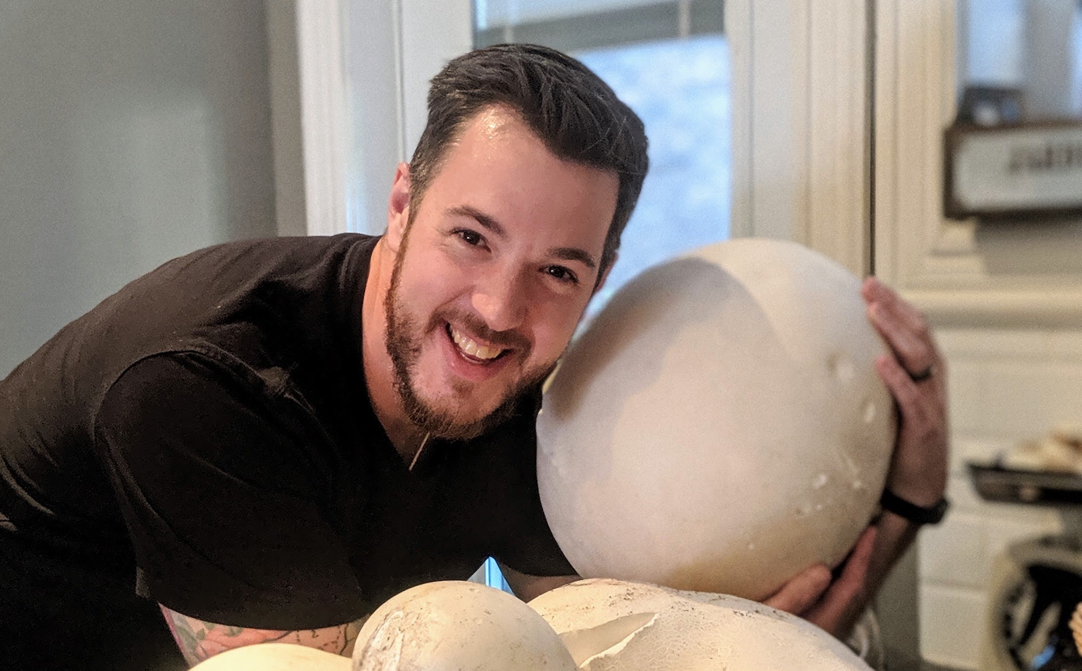 Robert Courteau with large puffball mushroom.
