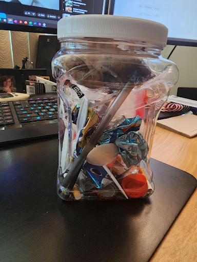A jar of examples of what might be collected during citizen science project Marine Debris Tracker.