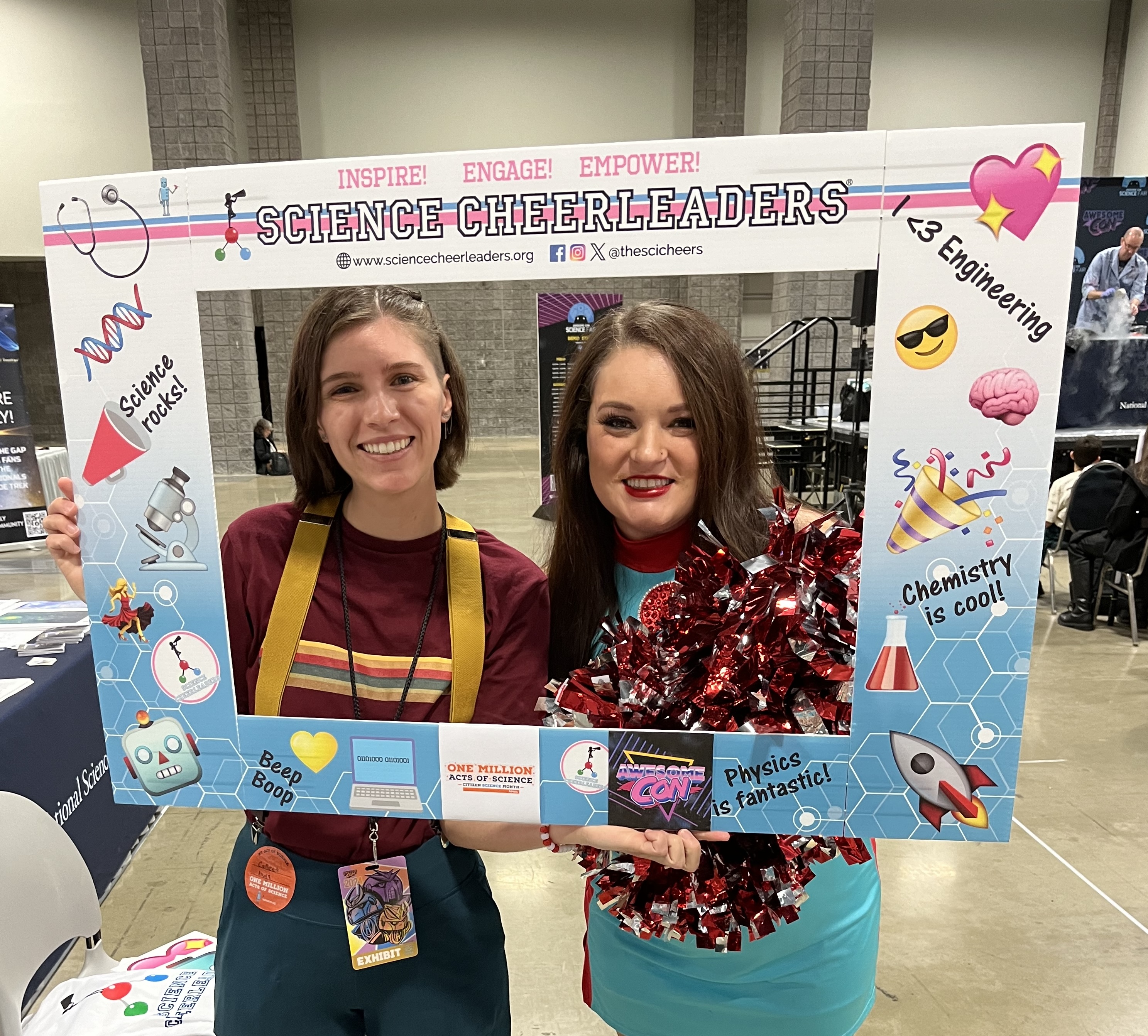 Photo of Emma Giles from SciStarter and Science Cheerleader Janel inside a frame for Science Cheerleaders