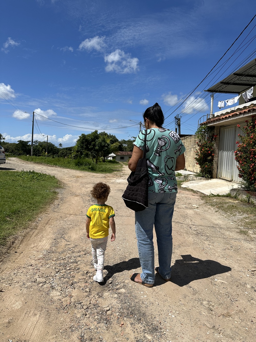 Project volunteer Emília Valentina (2) and her grandmother, Eleonora Alencar, a community health agent for over 23 years, mapping public health and biological vectors along the rural roads of Igarassu, Pernambuco, Brazil.